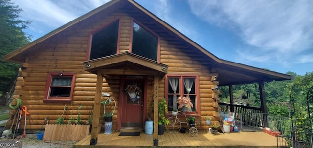 view of outbuilding featuring fence