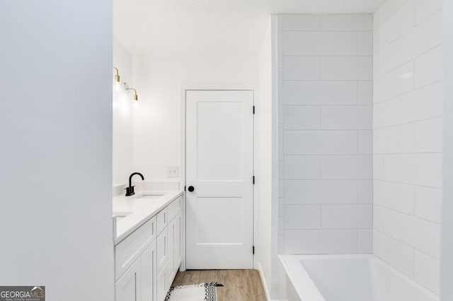 bathroom with vanity and hardwood / wood-style floors