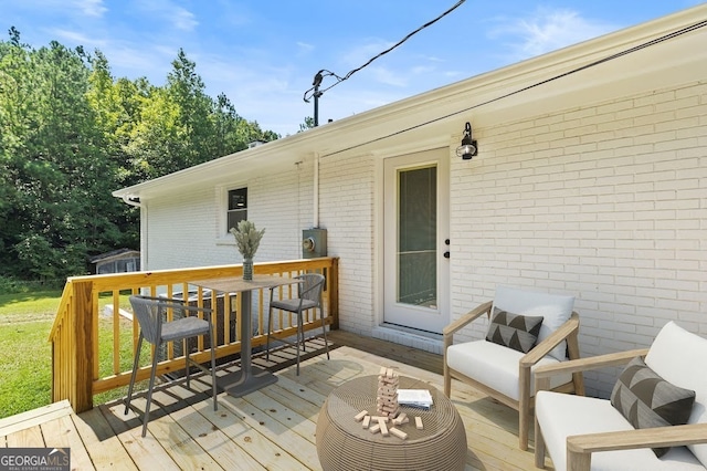 deck featuring outdoor lounge area