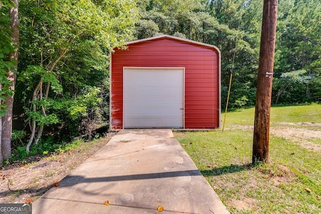 garage featuring a yard