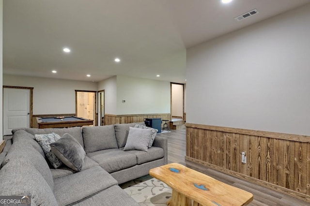 living room featuring light hardwood / wood-style flooring and billiards