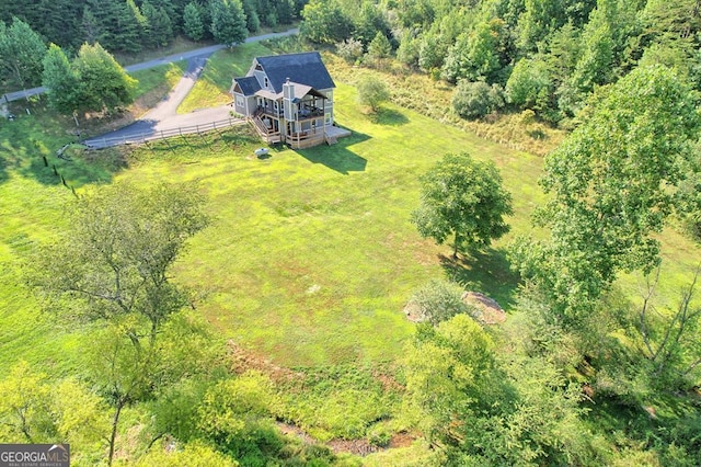 aerial view featuring a wooded view