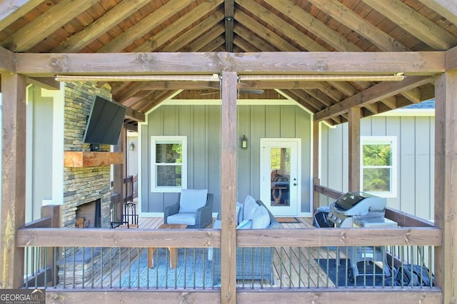 exterior space with a stone fireplace