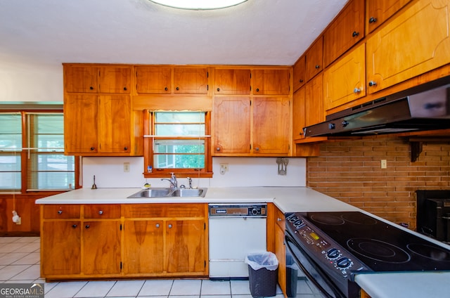 kitchen featuring sink, light tile patterned flooring, white dishwasher, and electric range