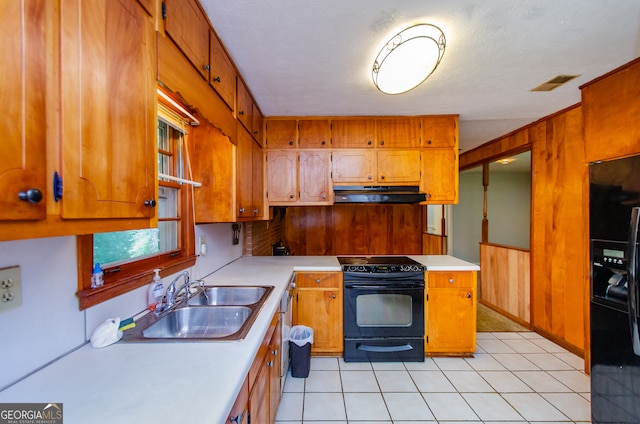 kitchen with light tile patterned floors, sink, and black appliances