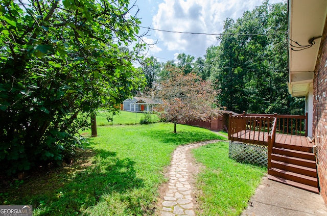 view of yard with a wooden deck