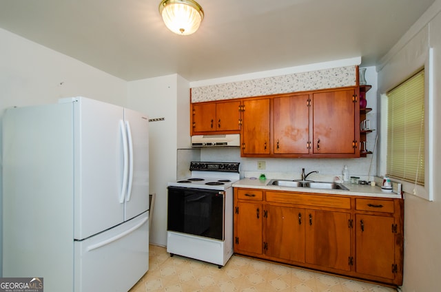 kitchen featuring sink, white appliances, light tile patterned floors, and decorative backsplash