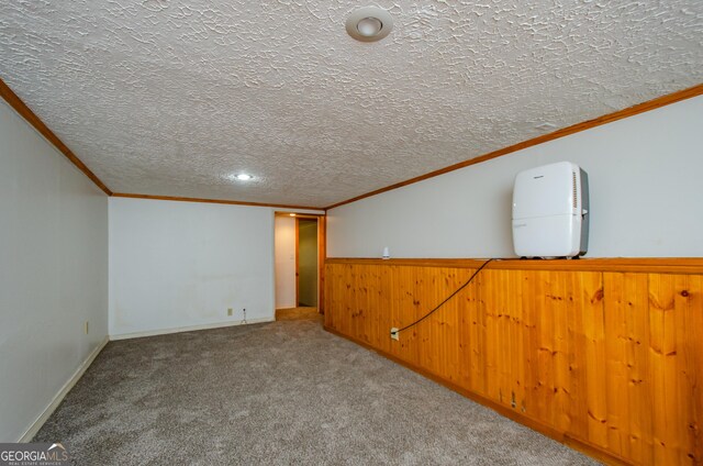 interior space featuring ornamental molding and a textured ceiling