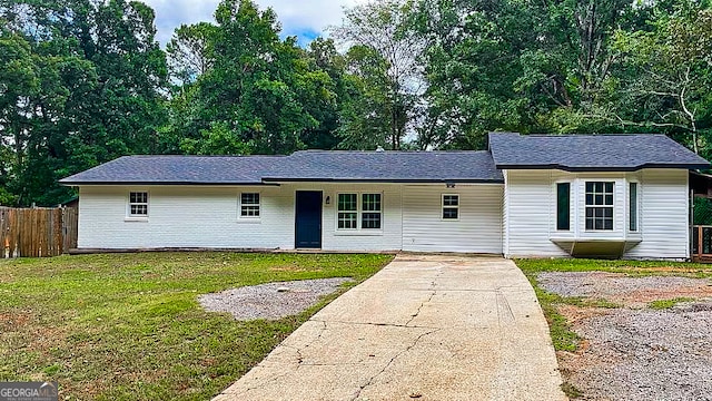 ranch-style house with a front lawn