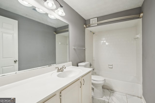 full bathroom featuring toilet, marble finish floor, a textured ceiling, vanity, and shower / washtub combination