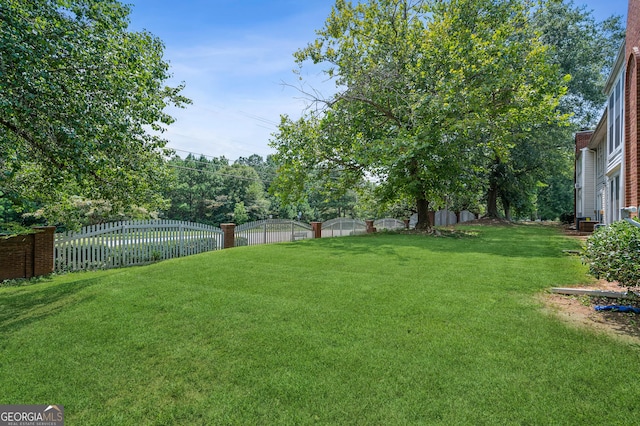 view of yard with a fenced backyard