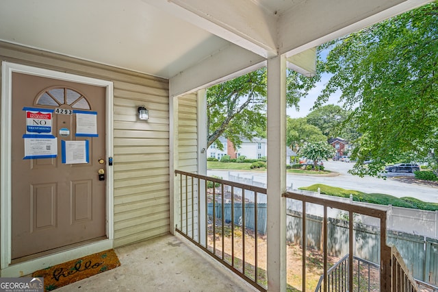 view of exterior entry with a porch