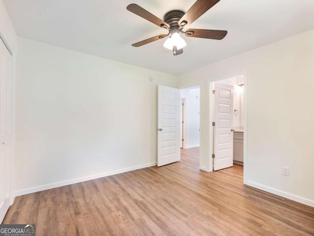 unfurnished bedroom with ensuite bath, ceiling fan, and light hardwood / wood-style flooring