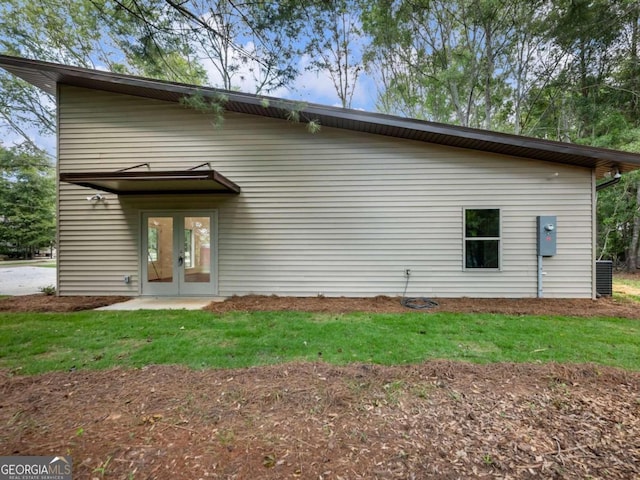 back of property featuring french doors