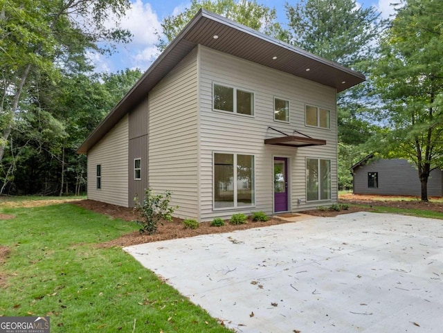 modern home with a front lawn