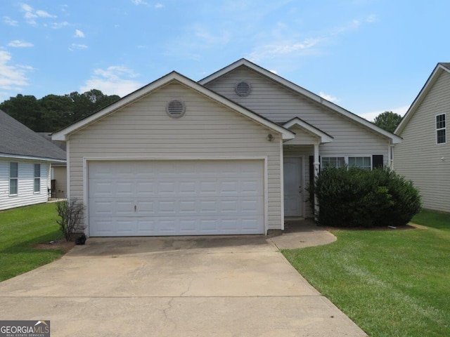 view of front of house featuring a garage and a front lawn