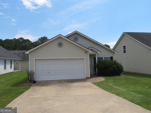 view of front of home featuring a garage and a front yard