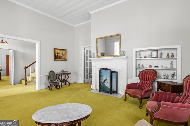 living room with a towering ceiling, crown molding, and carpet flooring