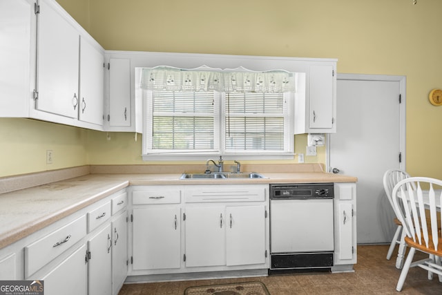 kitchen with white cabinetry, white dishwasher, and sink