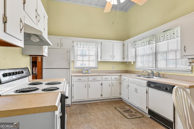 kitchen with white appliances, ceiling fan, sink, and white cabinets