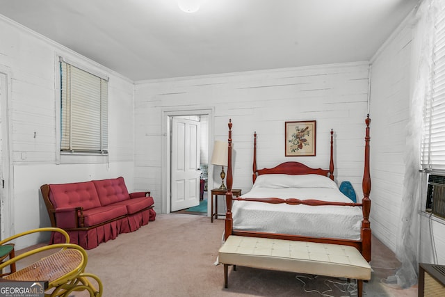 bedroom featuring ornamental molding and carpet floors