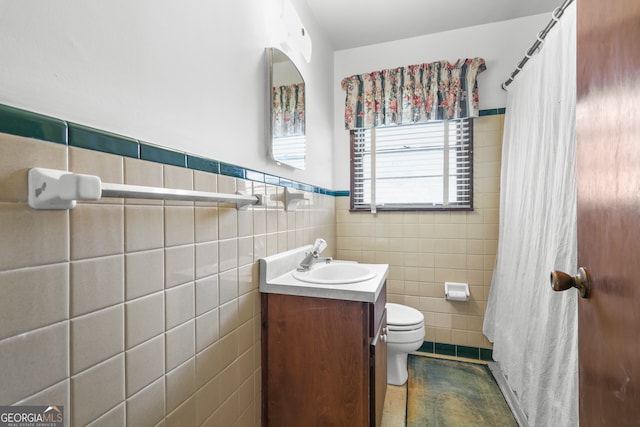 bathroom featuring vanity, toilet, tile walls, and a shower with curtain