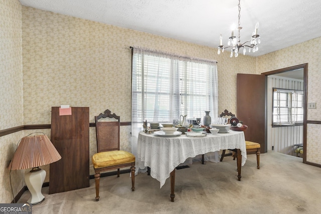 211 Main St, Franklin, GA 30217 - carpeted dining area featuring wallpapered walls, a chandelier, and a textured ceiling