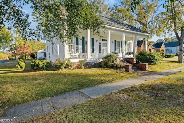 view of front of house with a front lawn and covered porch