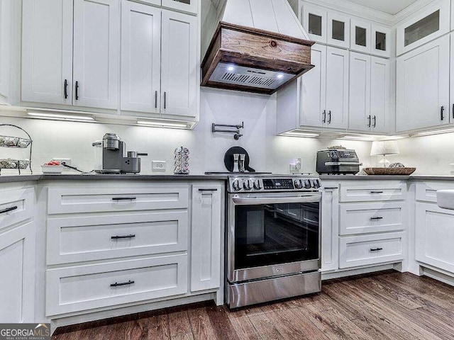 kitchen with stainless steel electric stove, custom exhaust hood, dark hardwood / wood-style floors, and white cabinets