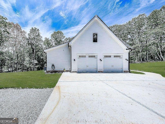 view of side of home with a lawn