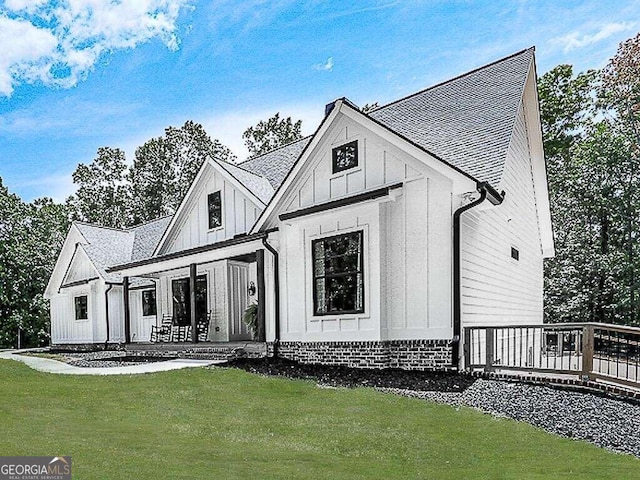 view of front of property with a front lawn and a deck