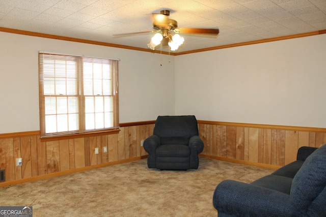 living area with ceiling fan, light carpet, and plenty of natural light