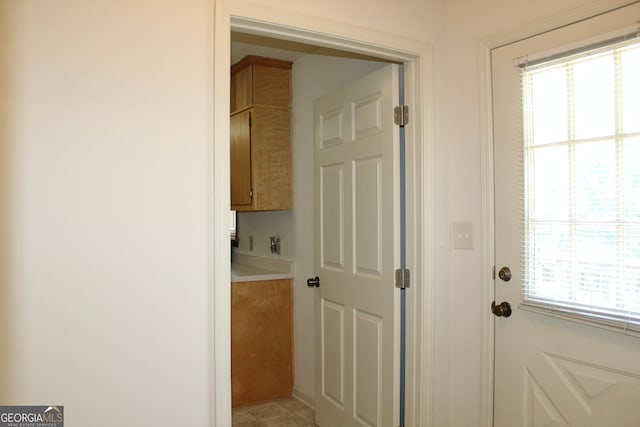 interior space with a wealth of natural light and light tile patterned floors