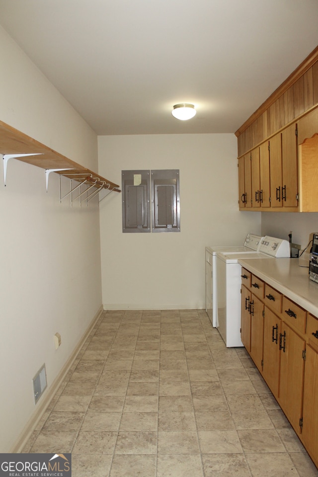 kitchen featuring light tile patterned floors and independent washer and dryer