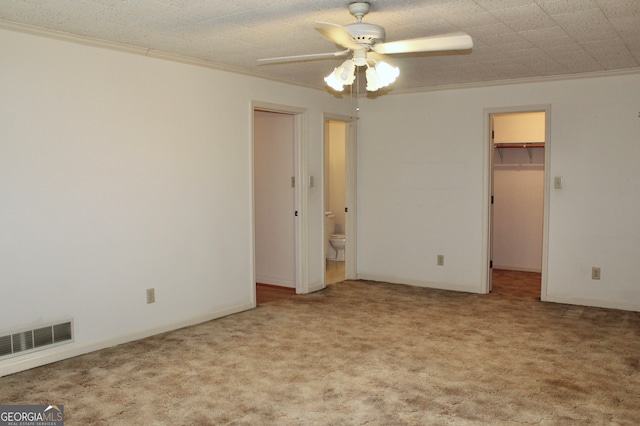 unfurnished room featuring ceiling fan and light colored carpet