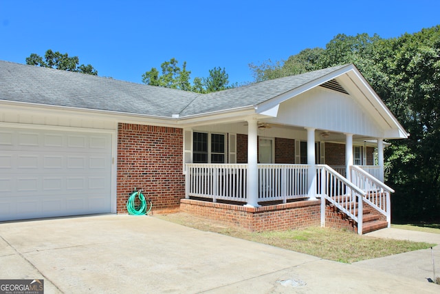 single story home with a garage and a porch