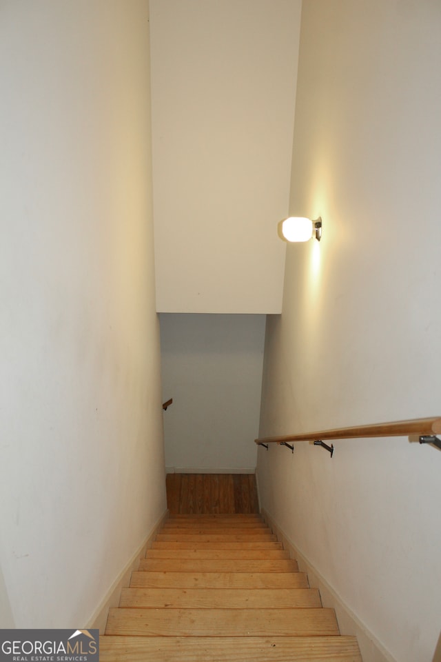 stairway with wood-type flooring