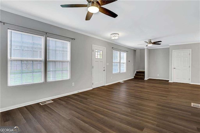 entryway with ornamental molding, dark hardwood / wood-style floors, and ceiling fan