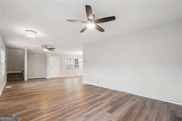 unfurnished living room with hardwood / wood-style floors and ceiling fan