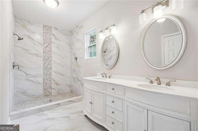 bathroom featuring vanity and a tile shower