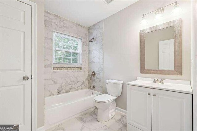 full bathroom with vanity, tiled shower / bath combo, toilet, and tile patterned flooring