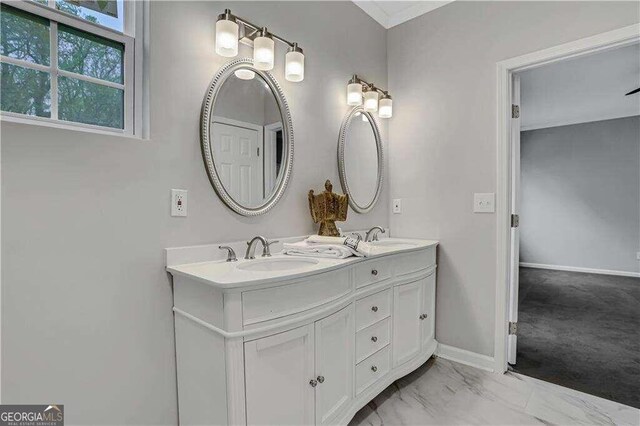 bathroom featuring tile patterned floors and dual bowl vanity