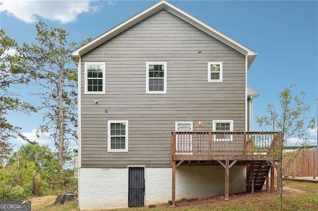 rear view of house with a deck