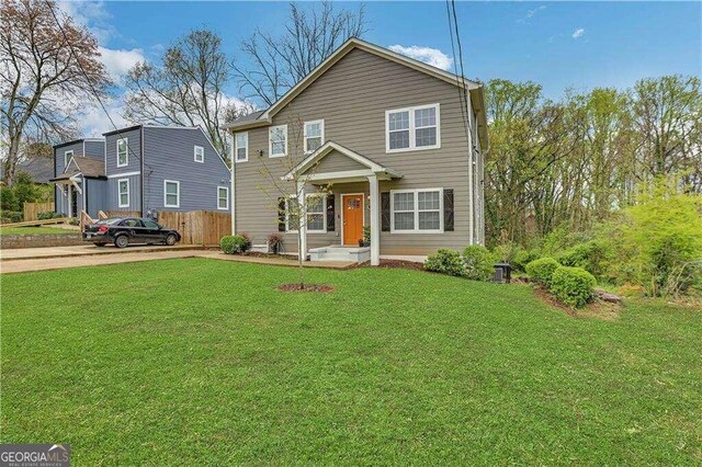 view of front of home with a front lawn