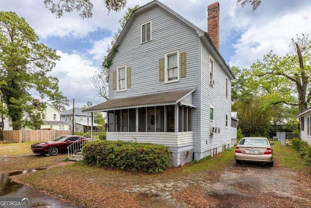 view of front of property with a sunroom