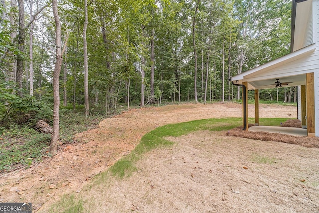 view of yard featuring ceiling fan