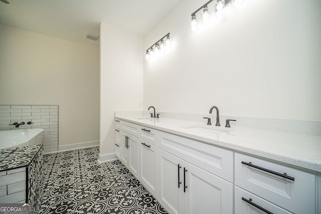 bathroom with tile patterned flooring and vanity