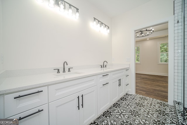 bathroom with vanity and wood-type flooring