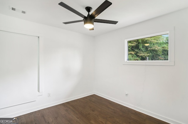 spare room featuring hardwood / wood-style flooring and ceiling fan