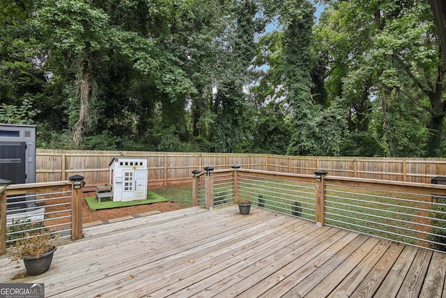 wooden terrace featuring a storage unit